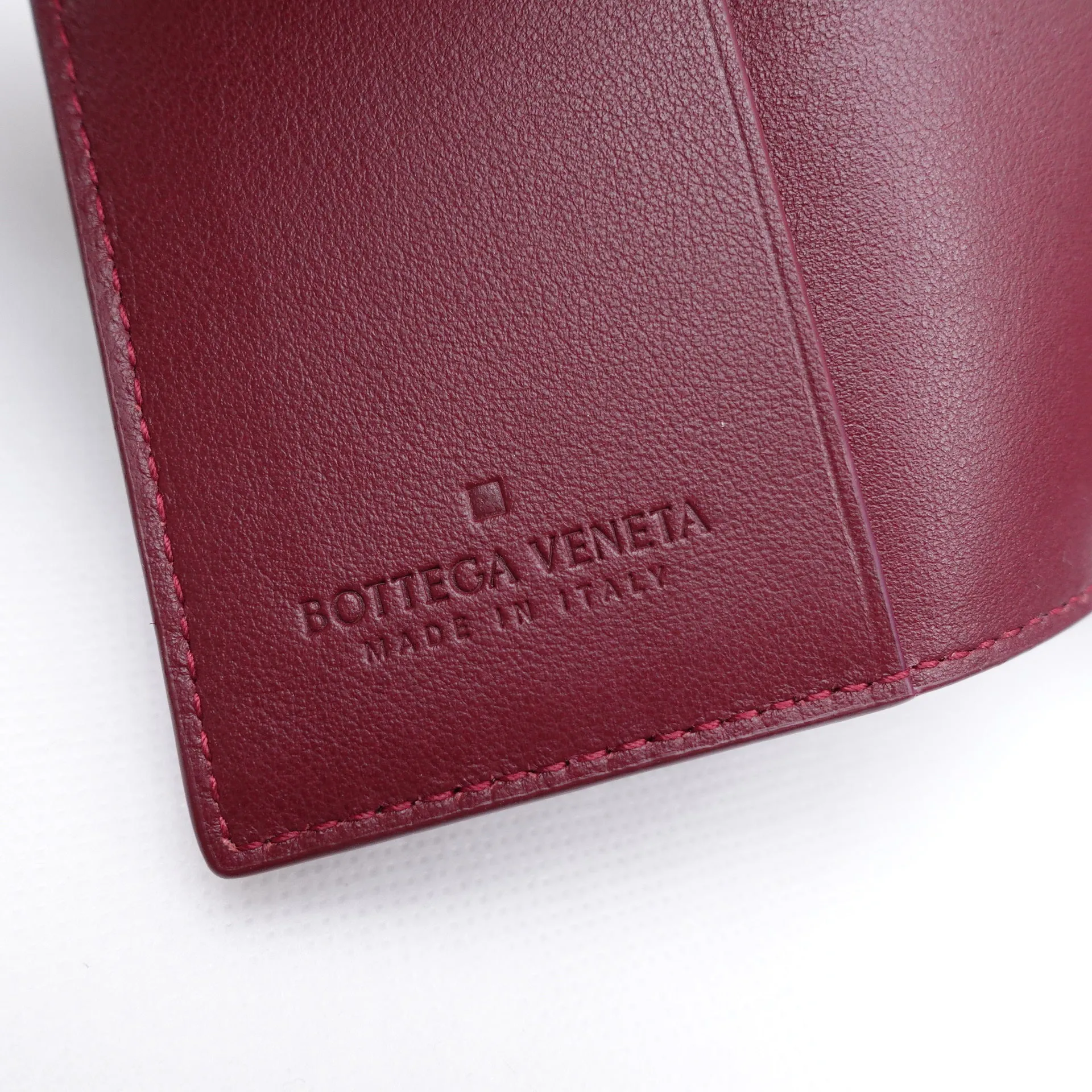 PRE-OWNED Burgundy Intrecciato Passport Holder